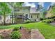 View of a fenced backyard with a deck and landscaped areas at 3535 Fairgreen Ct, Douglasville, GA 30135