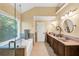 Bathroom featuring a large soaking tub, a walk-in glass shower, and dual sinks at 3535 Fairgreen Ct, Douglasville, GA 30135