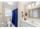 Bathroom featuring a tub with shower, a white vanity, and modern fixtures at 3535 Fairgreen Ct, Douglasville, GA 30135