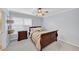 Bedroom featuring a ceiling fan, large window, light gray paint, and carpeted floors at 3535 Fairgreen Ct, Douglasville, GA 30135