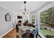 Dining area with views, hardwood floors, and stylish chandelier at 3535 Fairgreen Ct, Douglasville, GA 30135