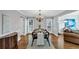 Dining room with hardwood floors, chandelier, and a view into the living room at 3535 Fairgreen Ct, Douglasville, GA 30135
