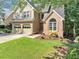 Charming two-story home featuring a brick facade, well-maintained lawn, and attached two-car garage at 3535 Fairgreen Ct, Douglasville, GA 30135