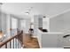 Beautiful hallway with hardwood floors, neutral paint, and wood railings at 3535 Fairgreen Ct, Douglasville, GA 30135