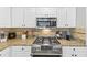 This well-equipped kitchen showcases granite counters, stainless appliances, and stylish backsplash at 3535 Fairgreen Ct, Douglasville, GA 30135