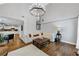 Open-concept living room boasts hardwood floors, fireplace, and large windows at 3535 Fairgreen Ct, Douglasville, GA 30135