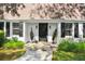 Inviting front door with classic black shutters and beautiful landscaping at 4234 Long Branch Ct, Brookhaven, GA 30319