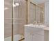 Elegant bathroom with a tub and glass shower door and a marble countertop sink at 750 Park Ne Ave # 6E, Atlanta, GA 30326