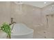 Bright bathroom showcases a modern tub, glass-enclosed shower, and serene neutral color palette at 750 Park Ne Ave # 6E, Atlanta, GA 30326