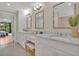 Bright bathroom with dual sinks, vanity space, and a view into the next room presents a refreshing design at 750 Park Ne Ave # 6E, Atlanta, GA 30326