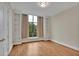 Bright bedroom with hardwood floors, built-in shelving, and large windows offers a flexible space at 750 Park Ne Ave # 6E, Atlanta, GA 30326