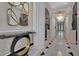 Entrance hall with stylish decor, marble floors, and custom art at 750 Park Ne Ave # 6E, Atlanta, GA 30326