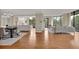 Open-concept living and dining area with hardwood floors and large windows offering abundant natural light and lovely views at 750 Park Ne Ave # 6E, Atlanta, GA 30326
