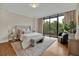 Main bedroom with hardwood floors, balcony access and plenty of natural light at 750 Park Ne Ave # 6E, Atlanta, GA 30326