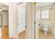 Tiled bathroom and closet with wire shelving and an entry to the bedroom at 8370 Royal Melbourne Way, Duluth, GA 30097