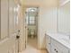 Bright bathroom with a granite vanity and a view into the tiled shower at 8370 Royal Melbourne Way, Duluth, GA 30097