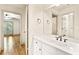 Bathroom featuring a granite vanity, and views into the bedroom at 8370 Royal Melbourne Way, Duluth, GA 30097