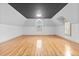 Spacious bedroom with light hardwood floors, neutral walls, and bright windows with shutters at 8370 Royal Melbourne Way, Duluth, GA 30097
