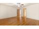 Bright bedroom with hardwood floors and neutral walls offers a tranquil space at 8370 Royal Melbourne Way, Duluth, GA 30097