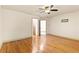 Large bedroom featuring hardwood floors with two entry doors at 8370 Royal Melbourne Way, Duluth, GA 30097
