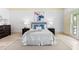Elegant bedroom showcases soothing decor, plantation shutters, and abundant natural light at 8370 Royal Melbourne Way, Duluth, GA 30097