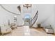 Spacious foyer with high ceilings, elegant staircase, and marble flooring, creating a grand entrance at 8370 Royal Melbourne Way, Duluth, GA 30097