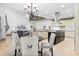Kitchen and breakfast nook with stainless steel appliances and custom cabinetry at 8370 Royal Melbourne Way, Duluth, GA 30097