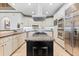 Kitchen features granite countertops, large island, and stainless steel appliances at 8370 Royal Melbourne Way, Duluth, GA 30097