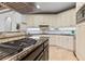 Kitchen features granite countertops, a large island, and tiled backsplash at 8370 Royal Melbourne Way, Duluth, GA 30097