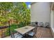 Relaxing outdoor deck with patio furniture and wooded view at 11259 Calypso Dr, Alpharetta, GA 30009