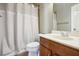 Simple bathroom design with neutral tones, a shower curtain, and single sink at 11259 Calypso Dr, Alpharetta, GA 30009