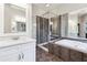 Contemporary bathroom with a glass shower, double vanity, and soaking tub at 11259 Calypso Dr, Alpharetta, GA 30009