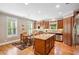 Well-equipped kitchen featuring hardwood floors, stainless steel appliances, and center island at 11259 Calypso Dr, Alpharetta, GA 30009