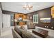 Cozy living room with a built-in bar, comfortable seating, and warm lighting at 11259 Calypso Dr, Alpharetta, GA 30009