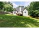 Expansive backyard featuring lush greenery, a well-maintained lawn, and mature trees, offering privacy and space at 1418 Winborn Nw Cir, Kennesaw, GA 30152