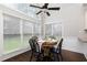 Cozy breakfast nook featuring large windows, a ceiling fan, and a round table at 1418 Winborn Nw Cir, Kennesaw, GA 30152