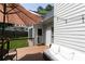 Inviting deck with outdoor seating, perfect for relaxing and enjoying the backyard view with string lights at 1418 Winborn Nw Cir, Kennesaw, GA 30152