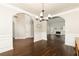Spacious formal dining room with hardwood flooring and an arched entryway at 1418 Winborn Nw Cir, Kennesaw, GA 30152