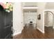 Inviting foyer with hardwood floors that leads to a spacious living area with a fireplace at 1418 Winborn Nw Cir, Kennesaw, GA 30152
