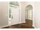 A front door opens to an open foyer and hardwood floors, leading into other rooms at 1418 Winborn Nw Cir, Kennesaw, GA 30152
