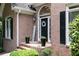 Close-up of a brick home's front door with a decorative wreath and a welcome sign at 1418 Winborn Nw Cir, Kennesaw, GA 30152