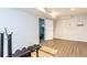 Bright workout room with gray wood floors and weight training equipment at 1418 Winborn Nw Cir, Kennesaw, GA 30152