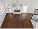Upstairs view of the living room showcases hardwood floors, fireplace, and plenty of natural light at 1418 Winborn Nw Cir, Kennesaw, GA 30152