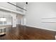 Open-concept living space featuring hardwood floors, arched doorways, and recessed lighting at 1418 Winborn Nw Cir, Kennesaw, GA 30152