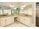 Bright bathroom with marble floors, granite counters, and an extra long vanity at 1418 Winborn Nw Cir, Kennesaw, GA 30152