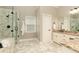 Bright main bathroom with glass shower, granite counters, and a large vanity mirror at 1418 Winborn Nw Cir, Kennesaw, GA 30152