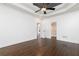 Large main bedroom with hardwood floors, ceiling fan, walk-in closet, and a view of the home at 1418 Winborn Nw Cir, Kennesaw, GA 30152