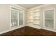 Bright home office featuring hardwood floors, built-in shelving and sun-filled windows at 1418 Winborn Nw Cir, Kennesaw, GA 30152
