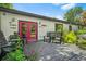 Charming backyard deck with pink doors, outdoor seating, decorative fish art, and lush greenery at 2296 N Shallowford Rd, Atlanta, GA 30341