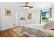 Cozy bedroom with hardwood floors, natural light, and an ensuite bathroom at 2296 N Shallowford Rd, Atlanta, GA 30341